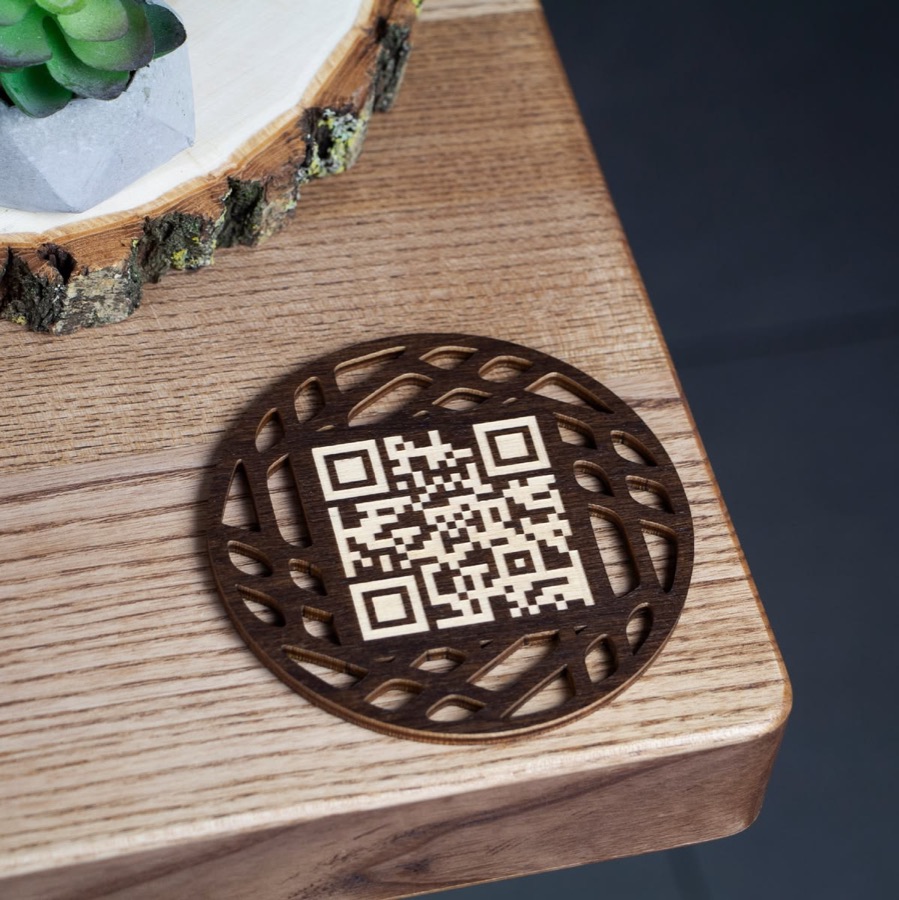 A guest scanning the QR code on a restaurant table with their phone